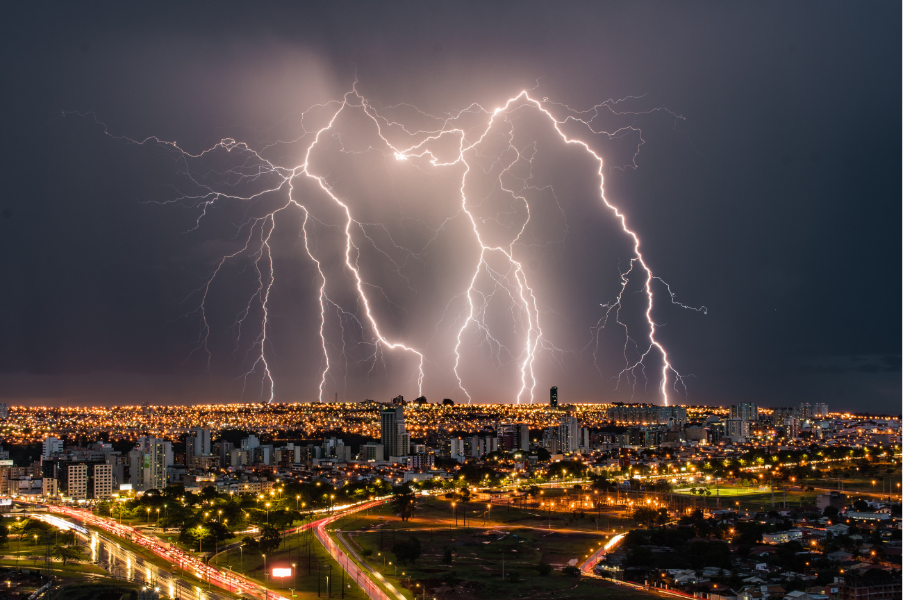 multiple lightning strikes city skyline